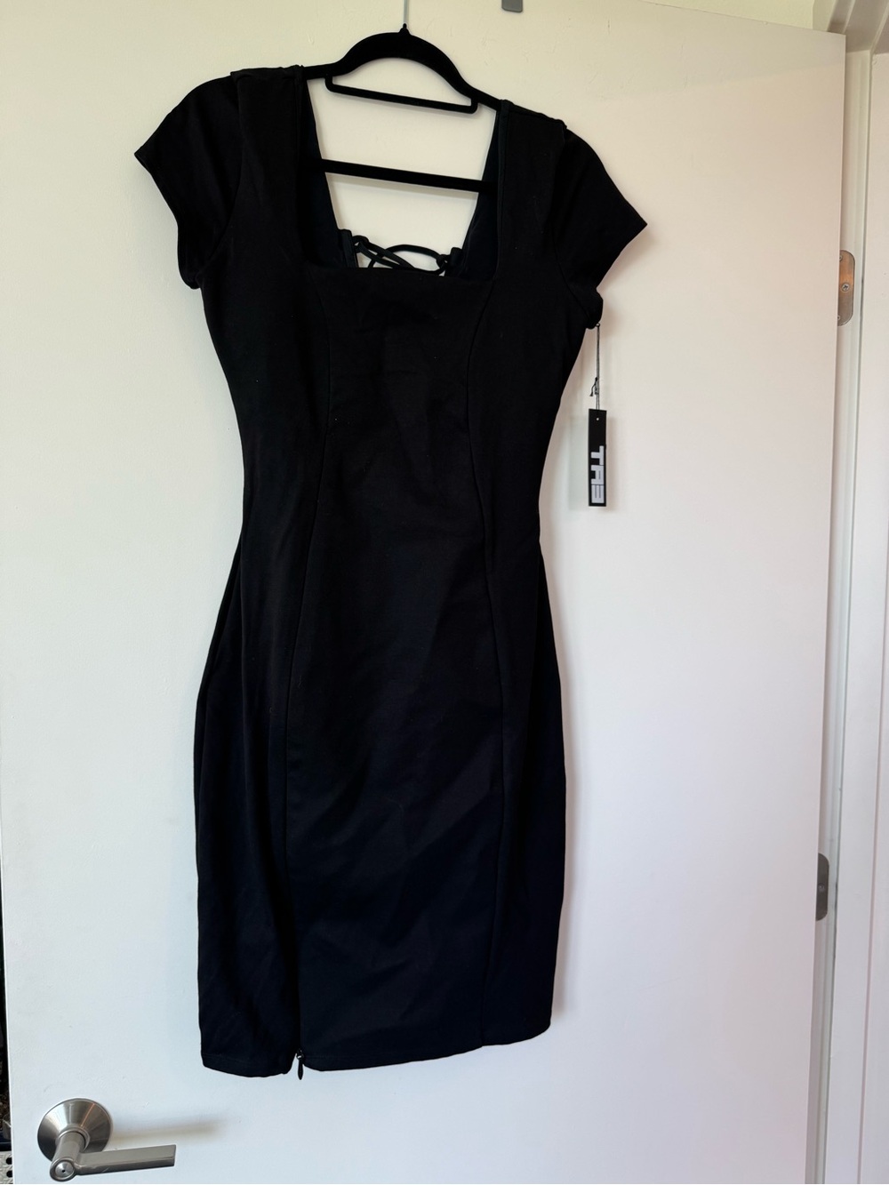 Black TA3 Swim sculpting dress.